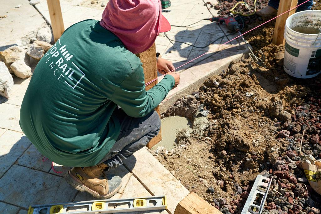 employee installing post