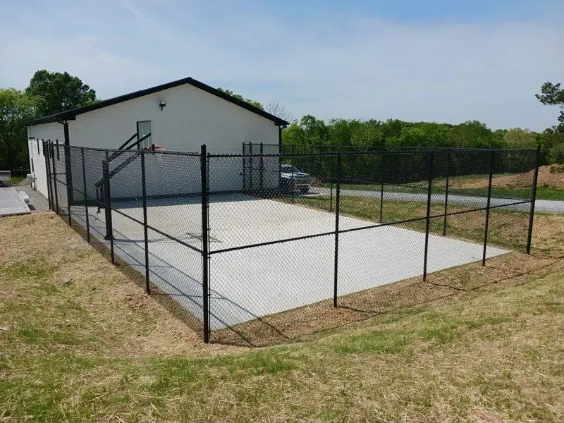 black chain link fence installed by top rail fence