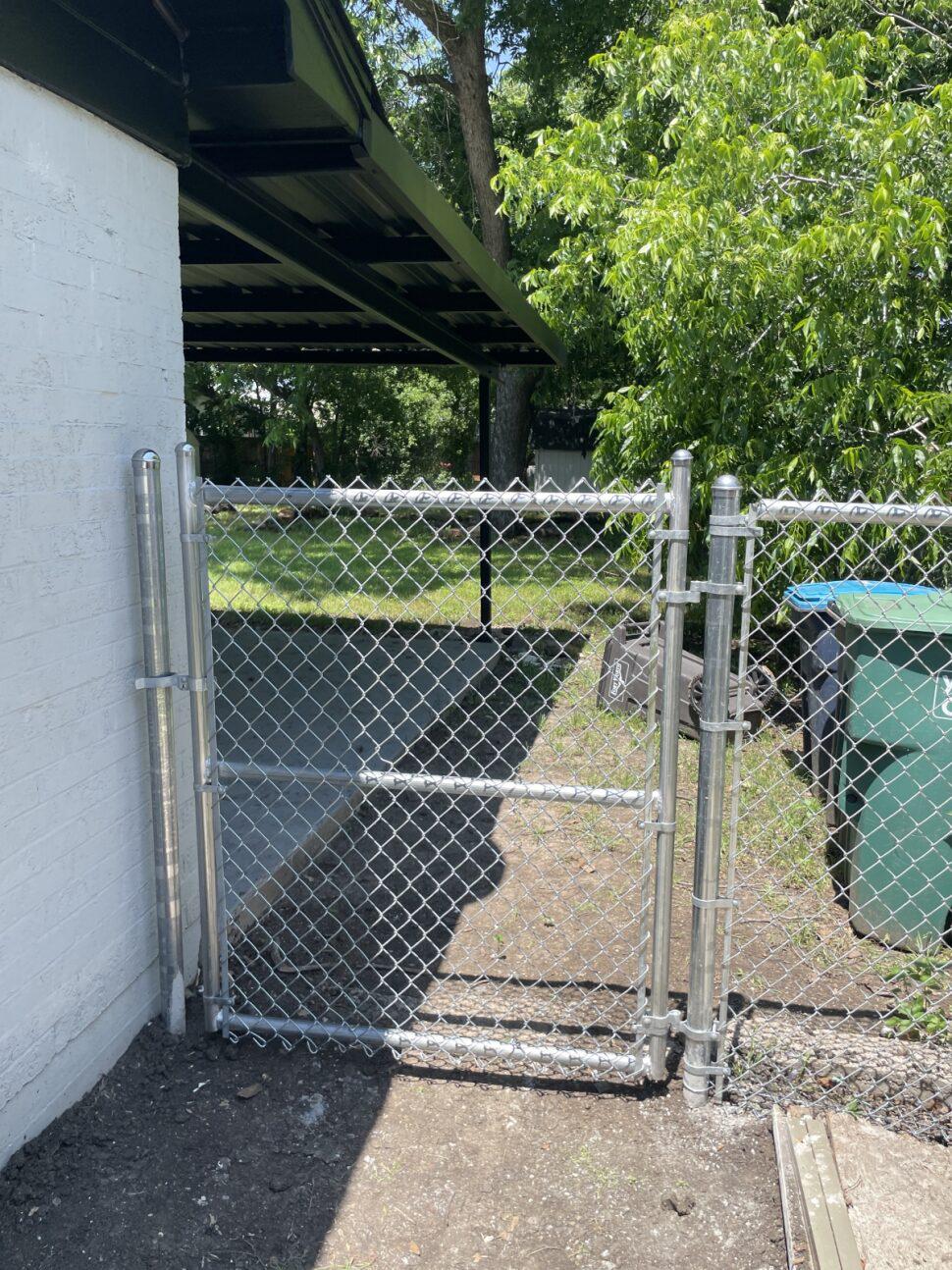 chain link fence installed by top rail fence