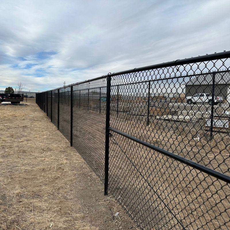 black chain link commercial fence installed by Top Rail Fence