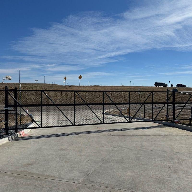 black chain link commercial gate installed by Top Rail Fence