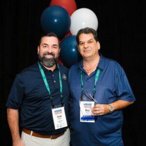 Bob Stewart, owner of Top Rail Fence Richmond, with his CARES award.