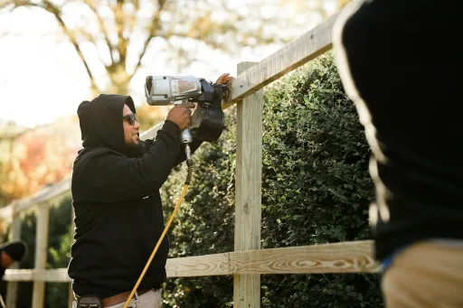 Top Rail Fence crew installing a wood fence