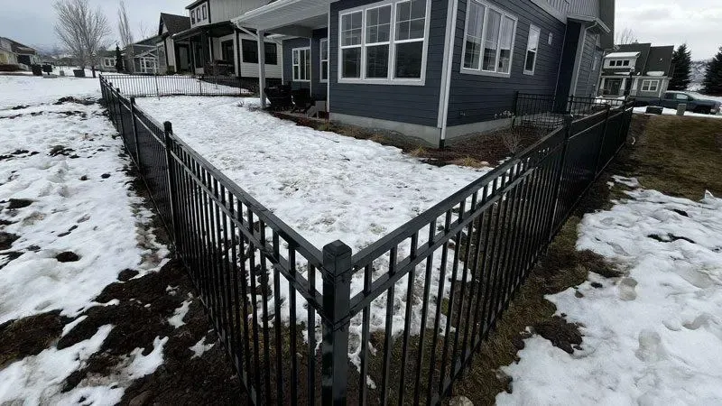  ornamental metal fence installed by top rail fence