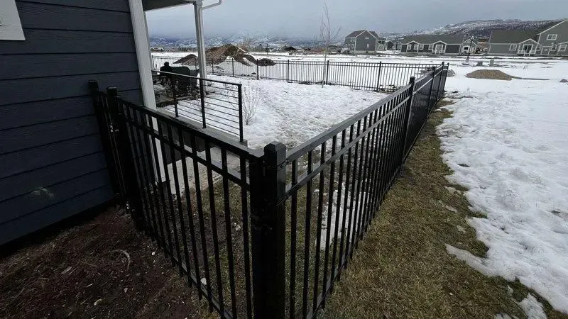  ornamental metal fence installed by top rail fence