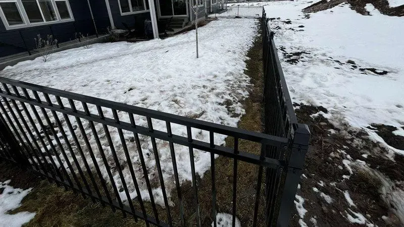 ornamental metal fence installed by top rail fence