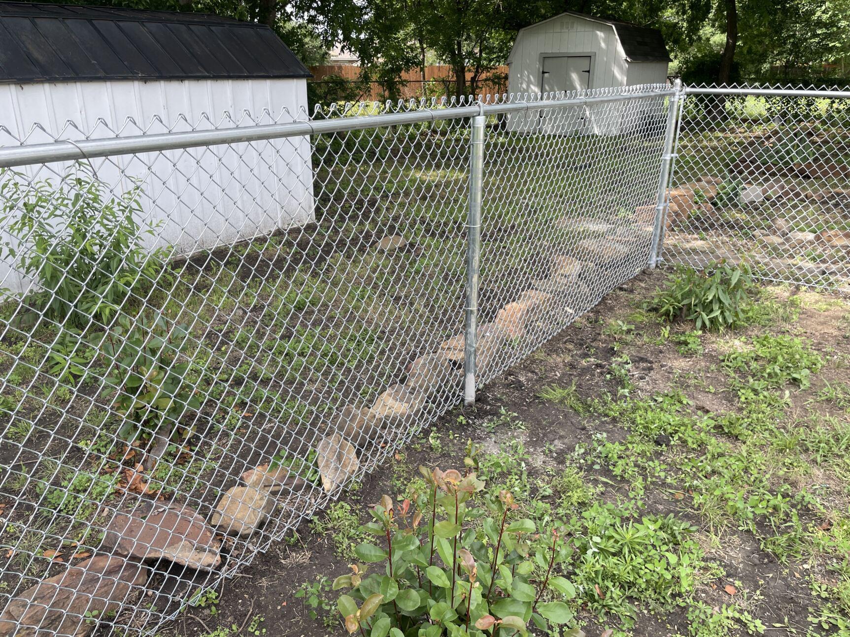 chain link fence installed by top rail fence
