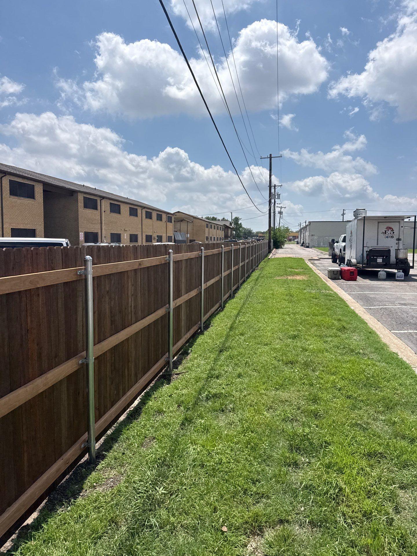 Cedar Wood & Chain Link Fence Installation at Gardens on Walnut Apartments