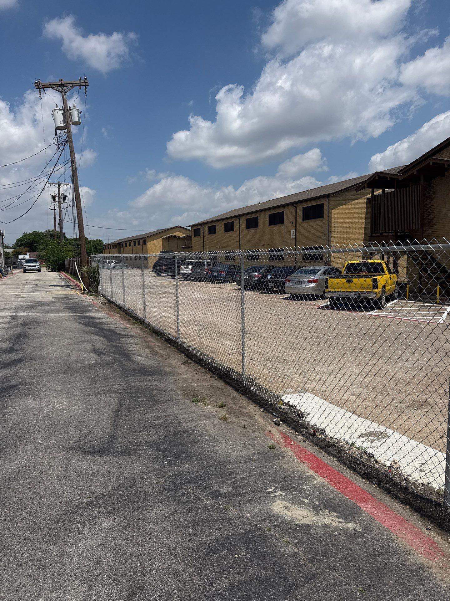 commercial fence installed by top rail fence