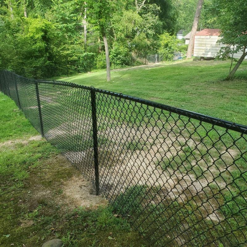 chain link fence installed by top rail fence