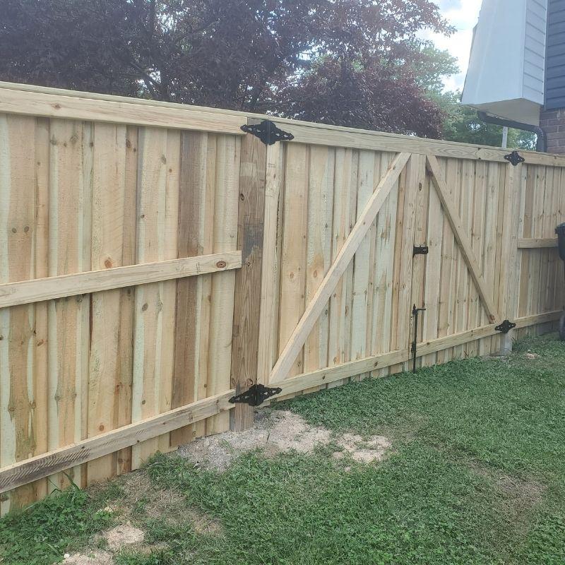 privacy fence installed by top rail fence