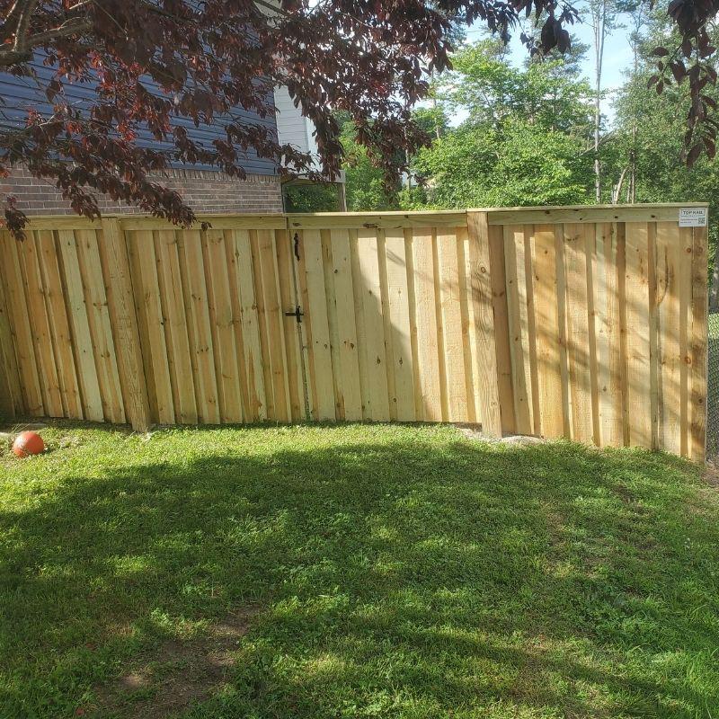 privacy fence installed by top rail fence