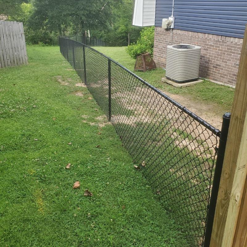 chain link fence installed by top rail fence