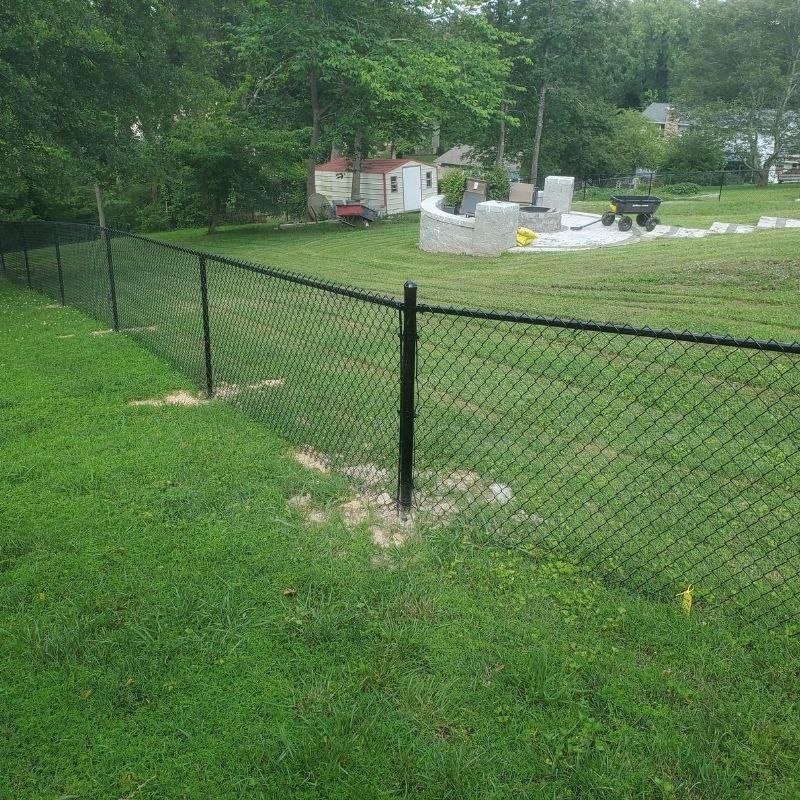 chain link fence installed by top rail fence