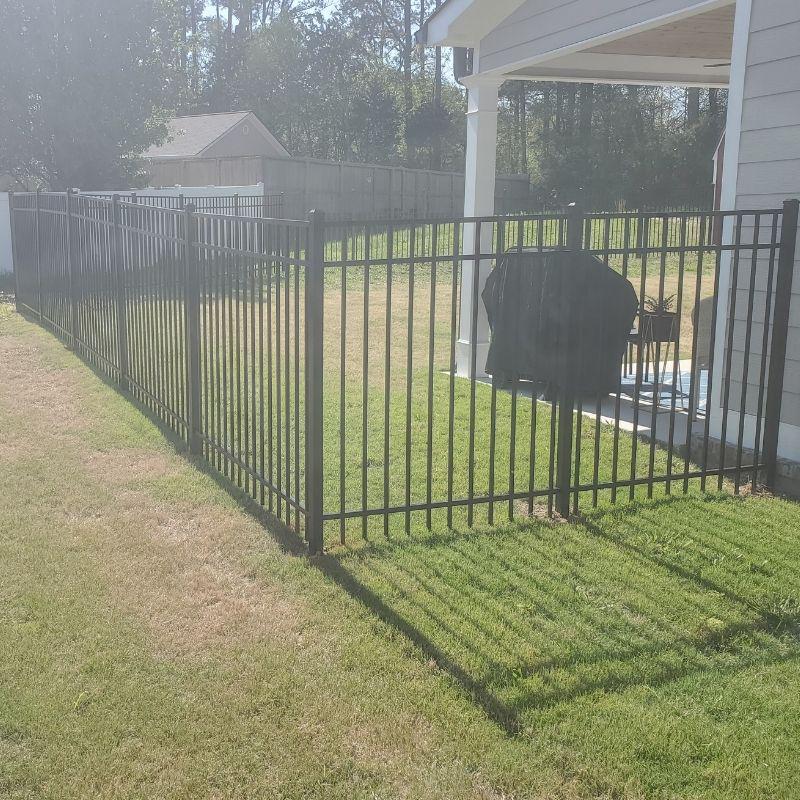 Aluminum ornamental fence installed by Top Rail Fence