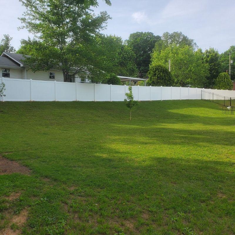 Vinyl Privacy Fence Installation by Top Rail Fence