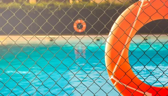 close up of chain link fence around a pool