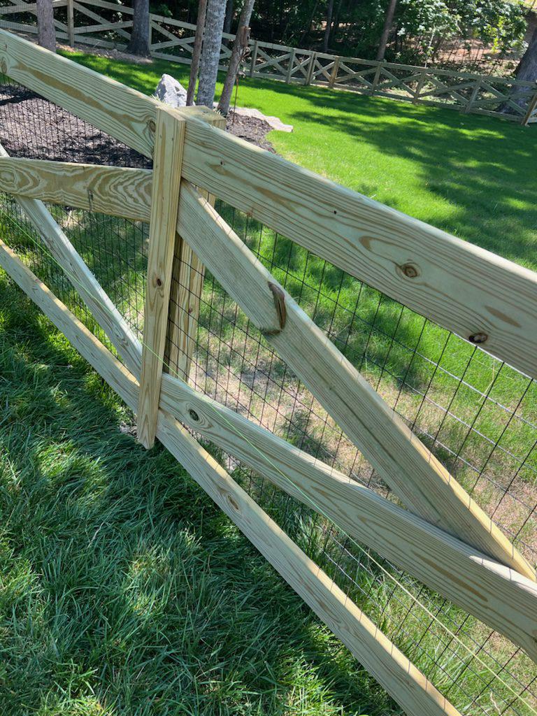 4ft high wooden cross buck farm fence install