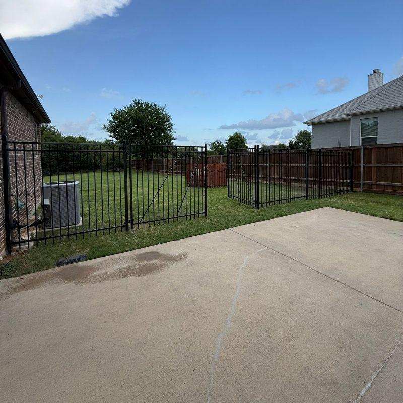 metal fence installed by top rail fence