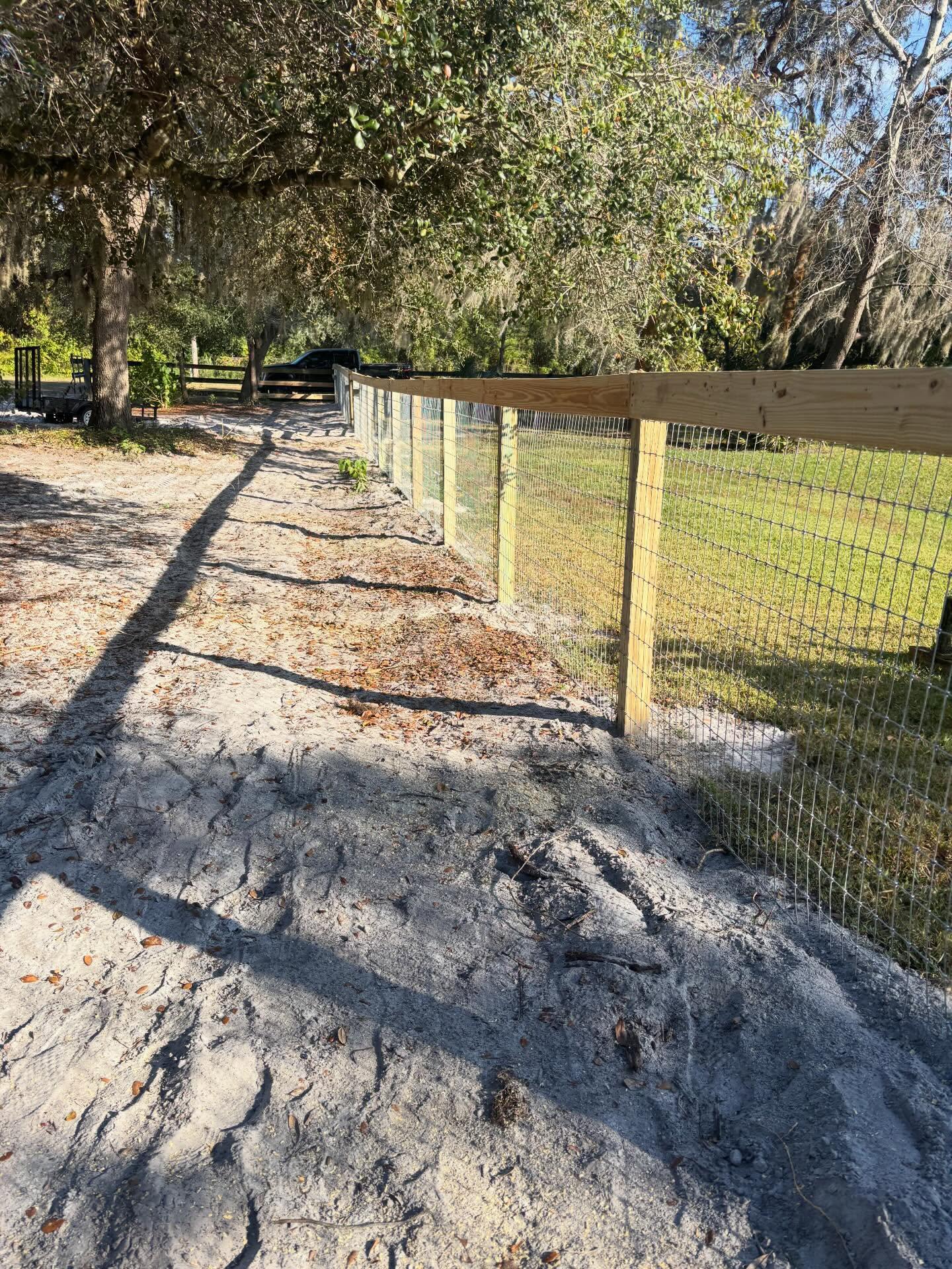 hogwire fence installed by top rail fence