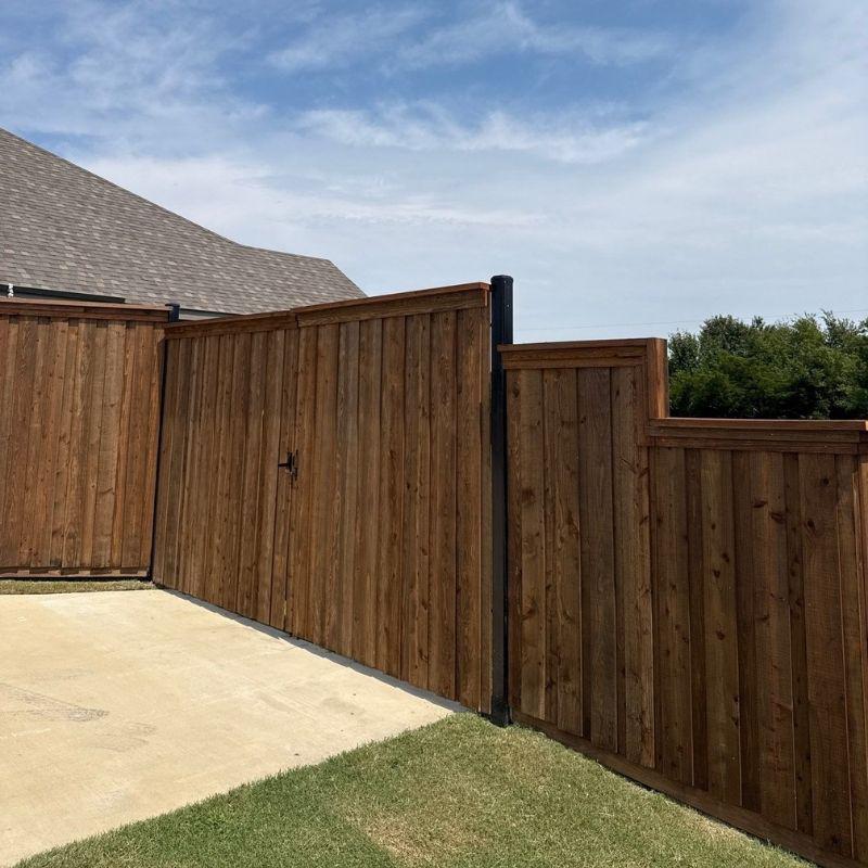 wood fence installed by top rail fence