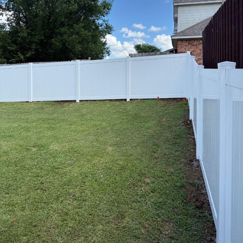 vinyl fence installed by top rail fence