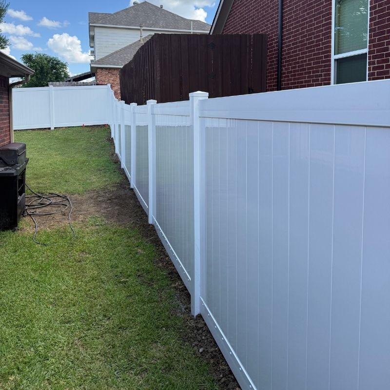 vinyl fence installed by top rail fence