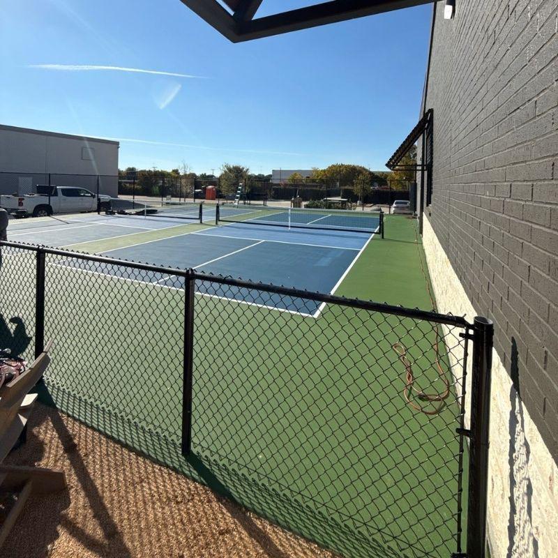 chain link fence installed by top rail fence