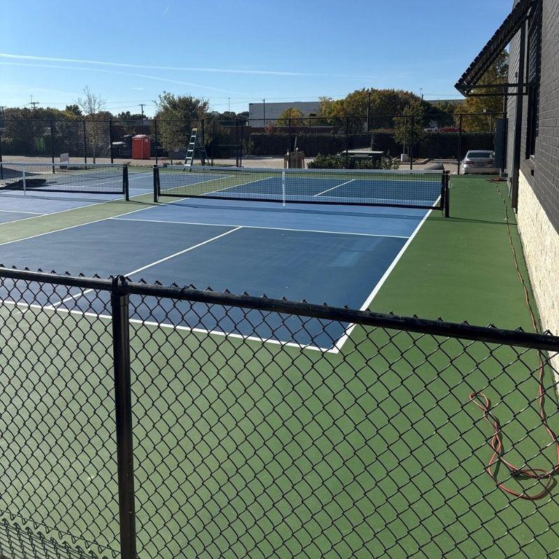 chain link fence installed by top rail fence