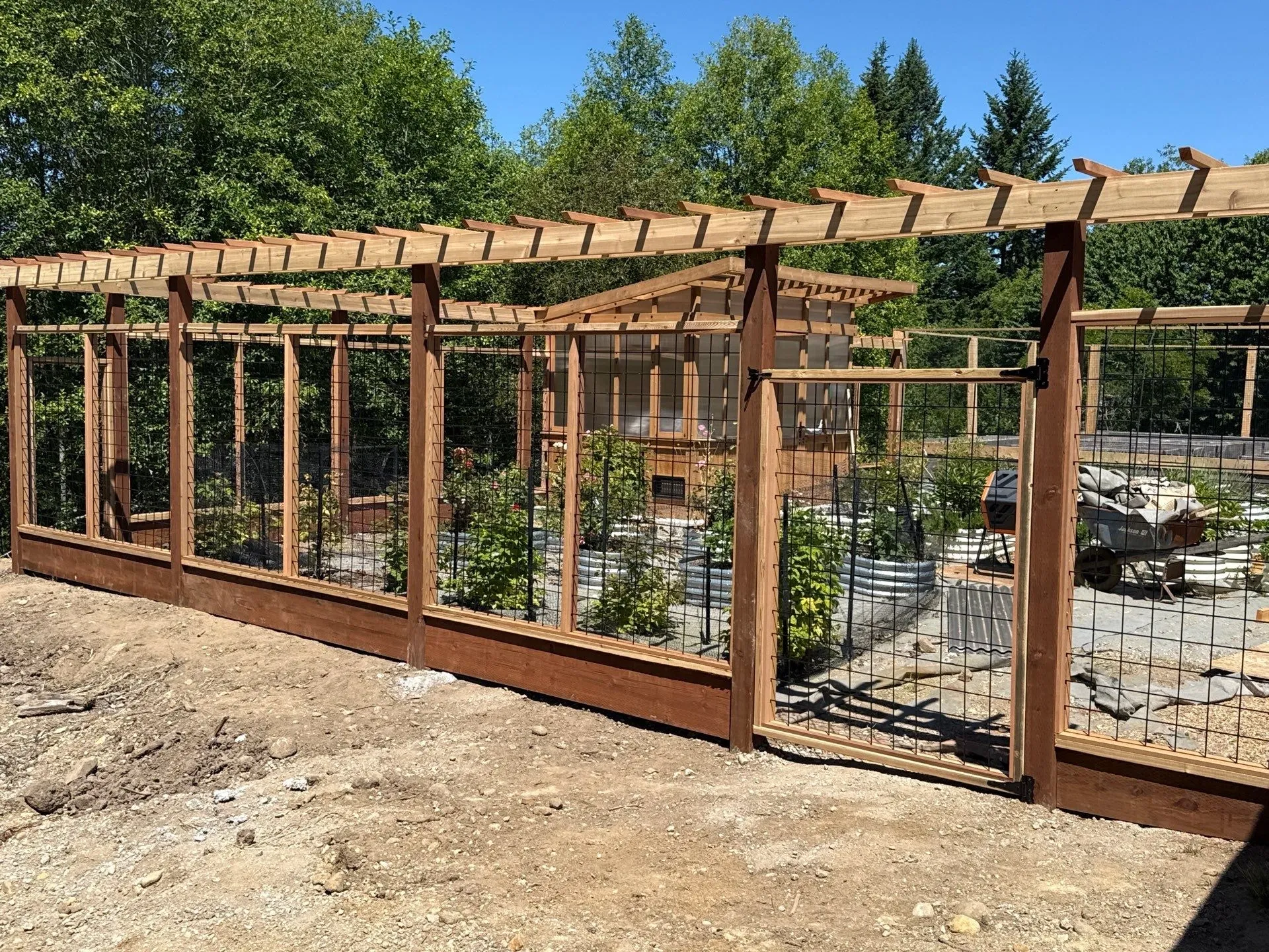 wood hog wire fence installed by top rail fence