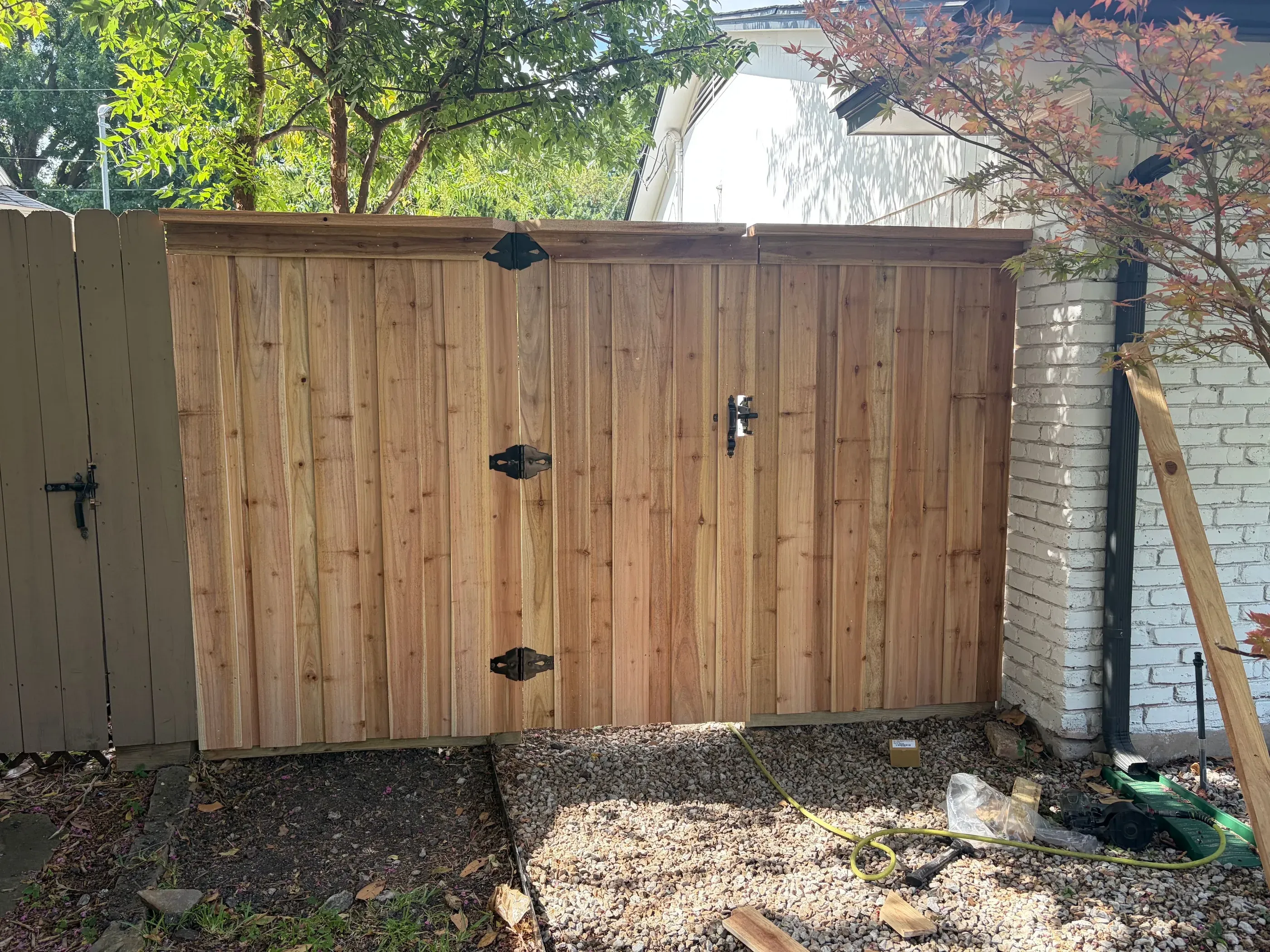 cedar board on board fence installed by top rail fence