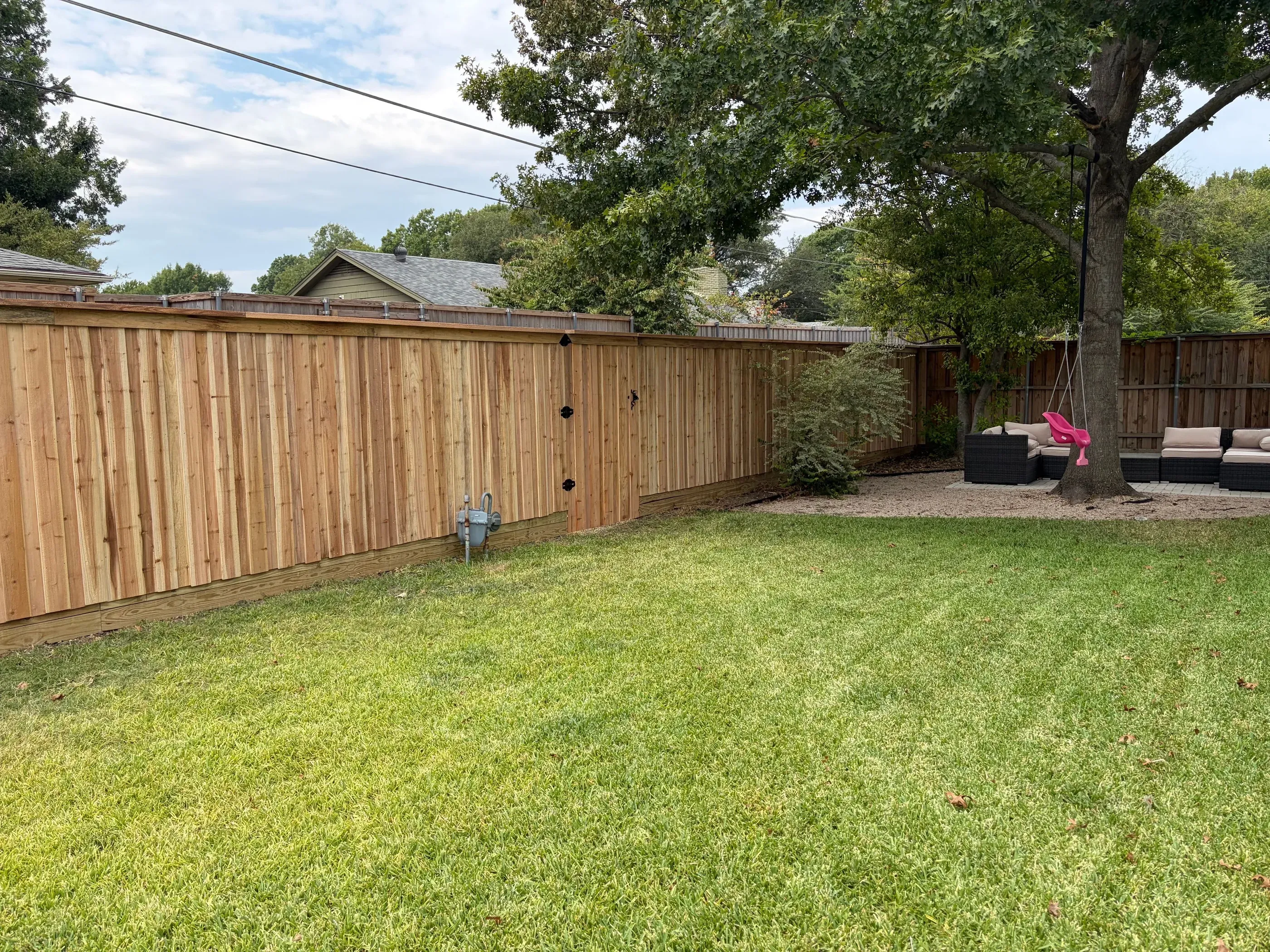 cedar board on board fence installed by top rail fence