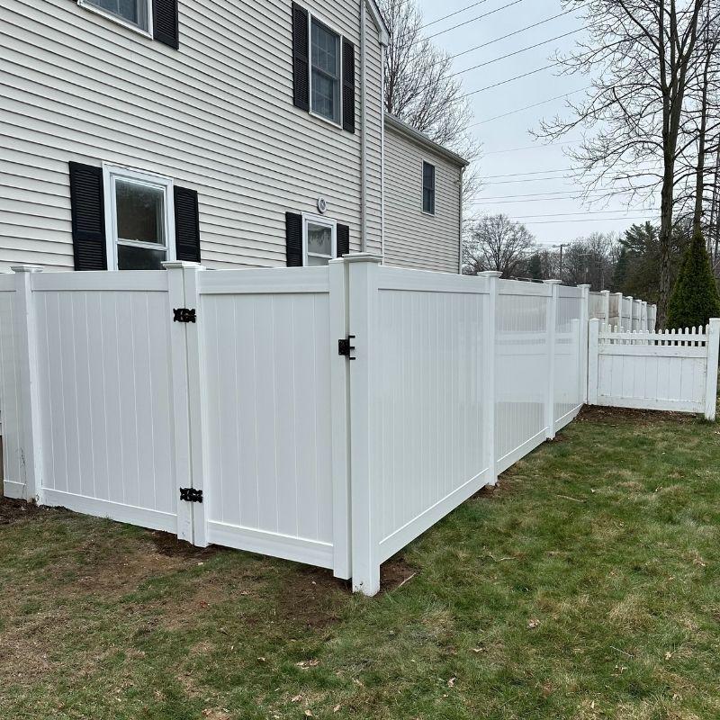 new white vinyl fence and gate installed by Top Rail Fence