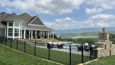 A house with a metal black fence