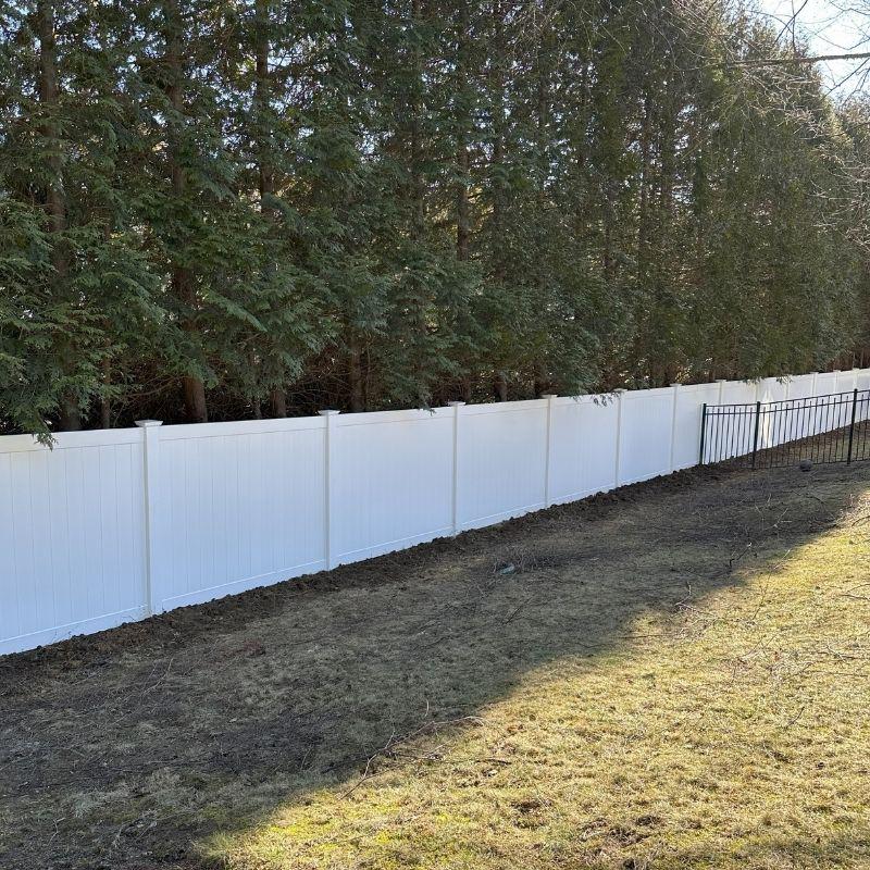 white vinyl fence installed by Top Rail Fence