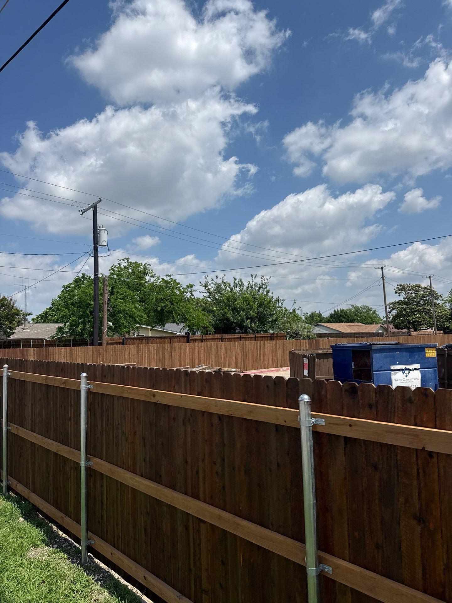 commercial fence installed by top rail fence