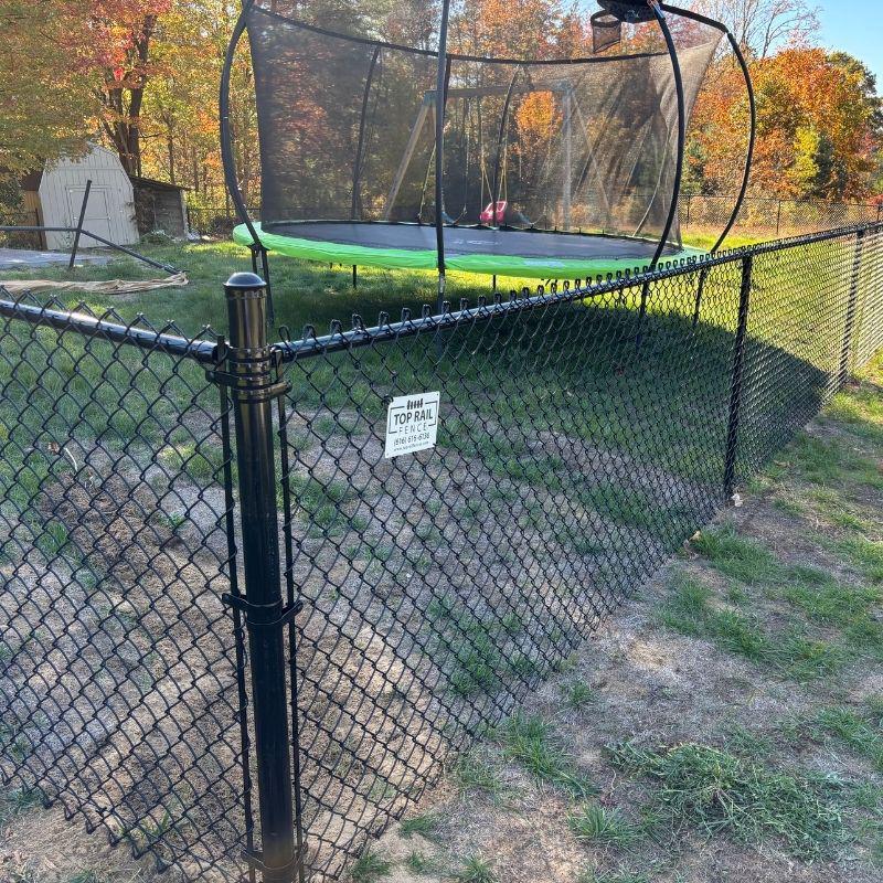 chain link fence installed by top rail fence holland