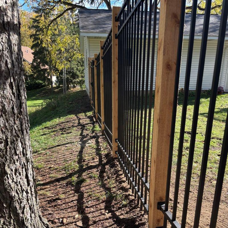 ornamental metal fence installed by top rail fence holland