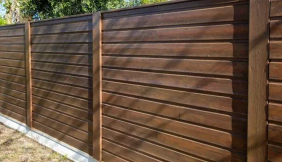 dark stained wood horizontal fence