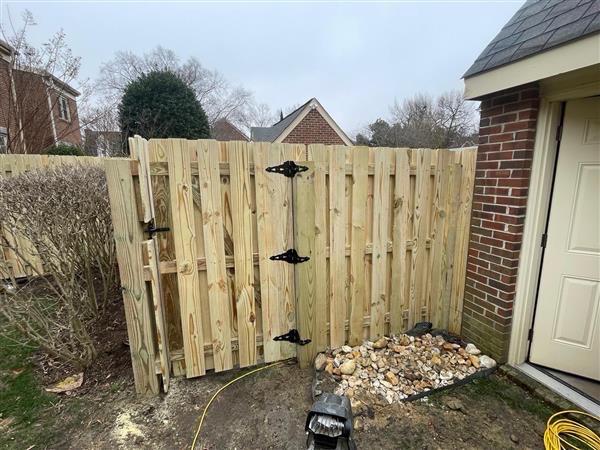 wood shadowbox fence installed by top rail fence