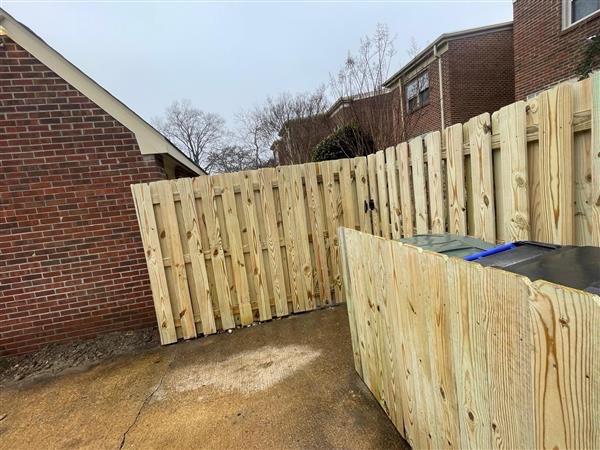 wood shadowbox fence installed by top rail fence