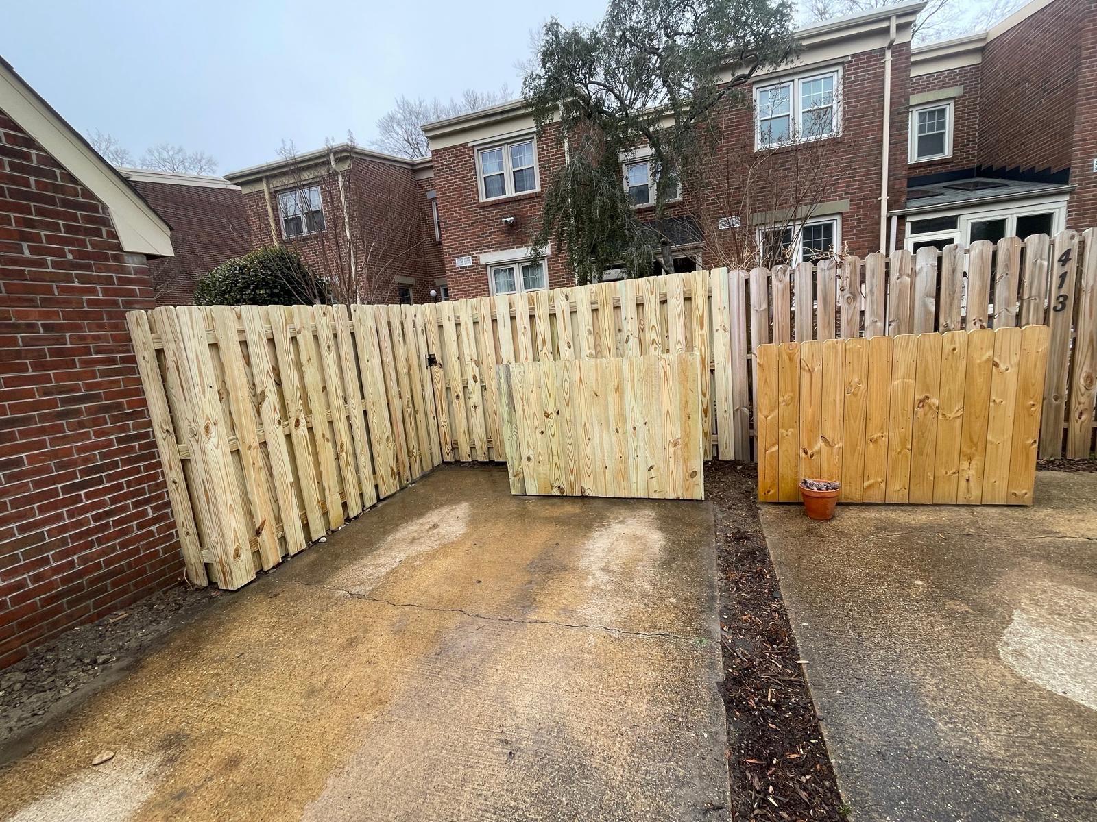 wood shadowbox fence installed by top rail fence
