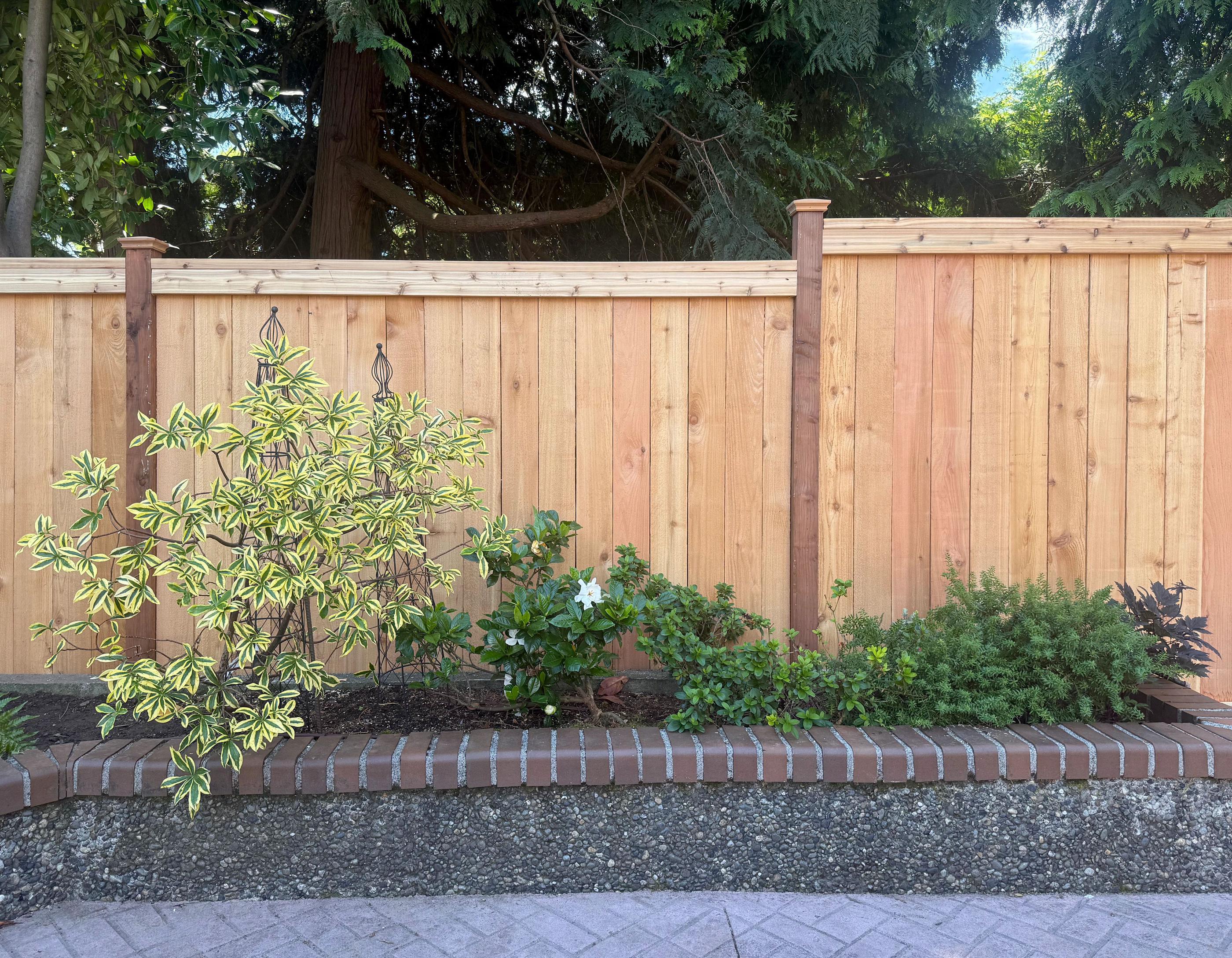 wood cap and trim fence installed by top rail fence