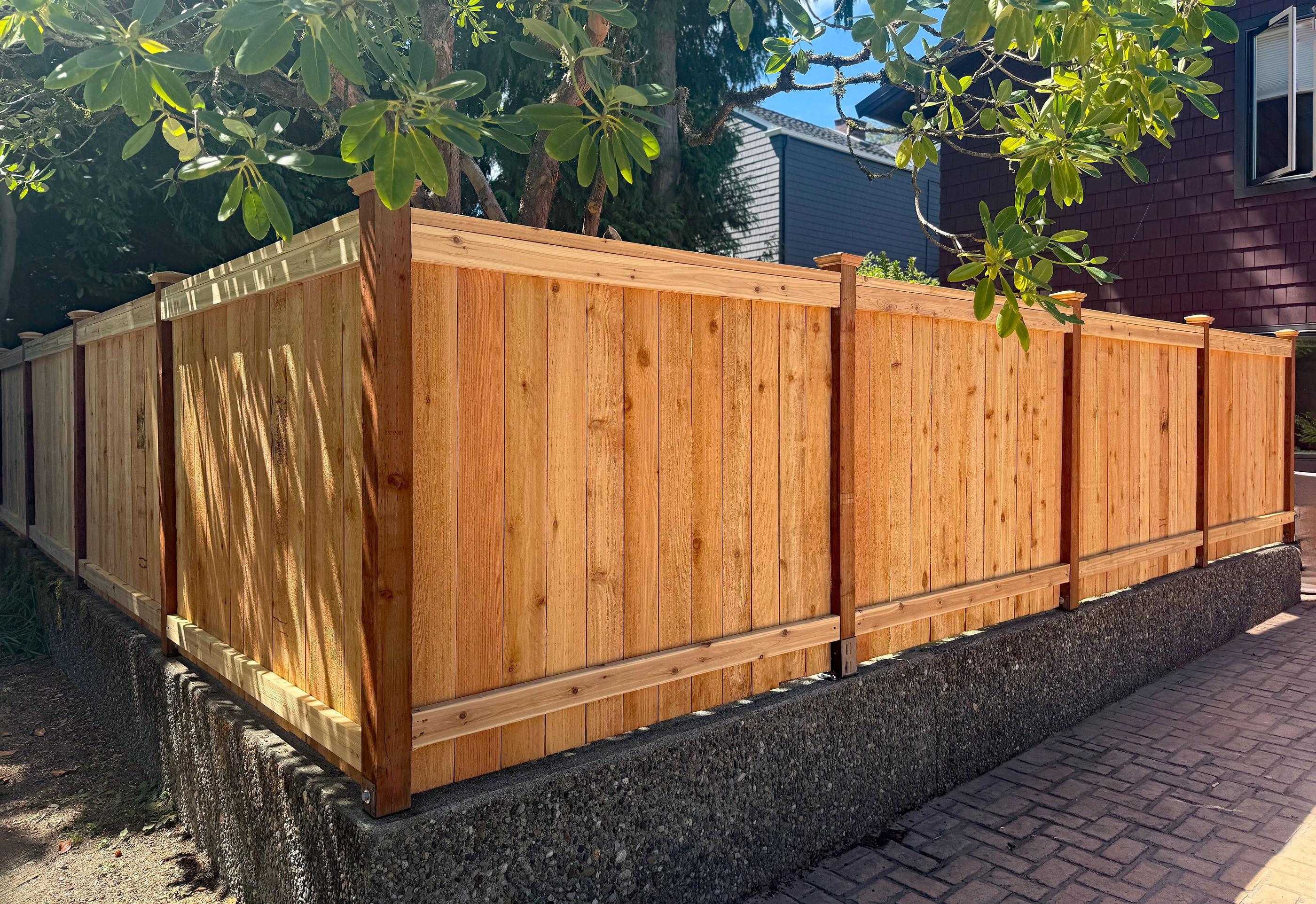 wood cap and trim fence installed by top rail fence