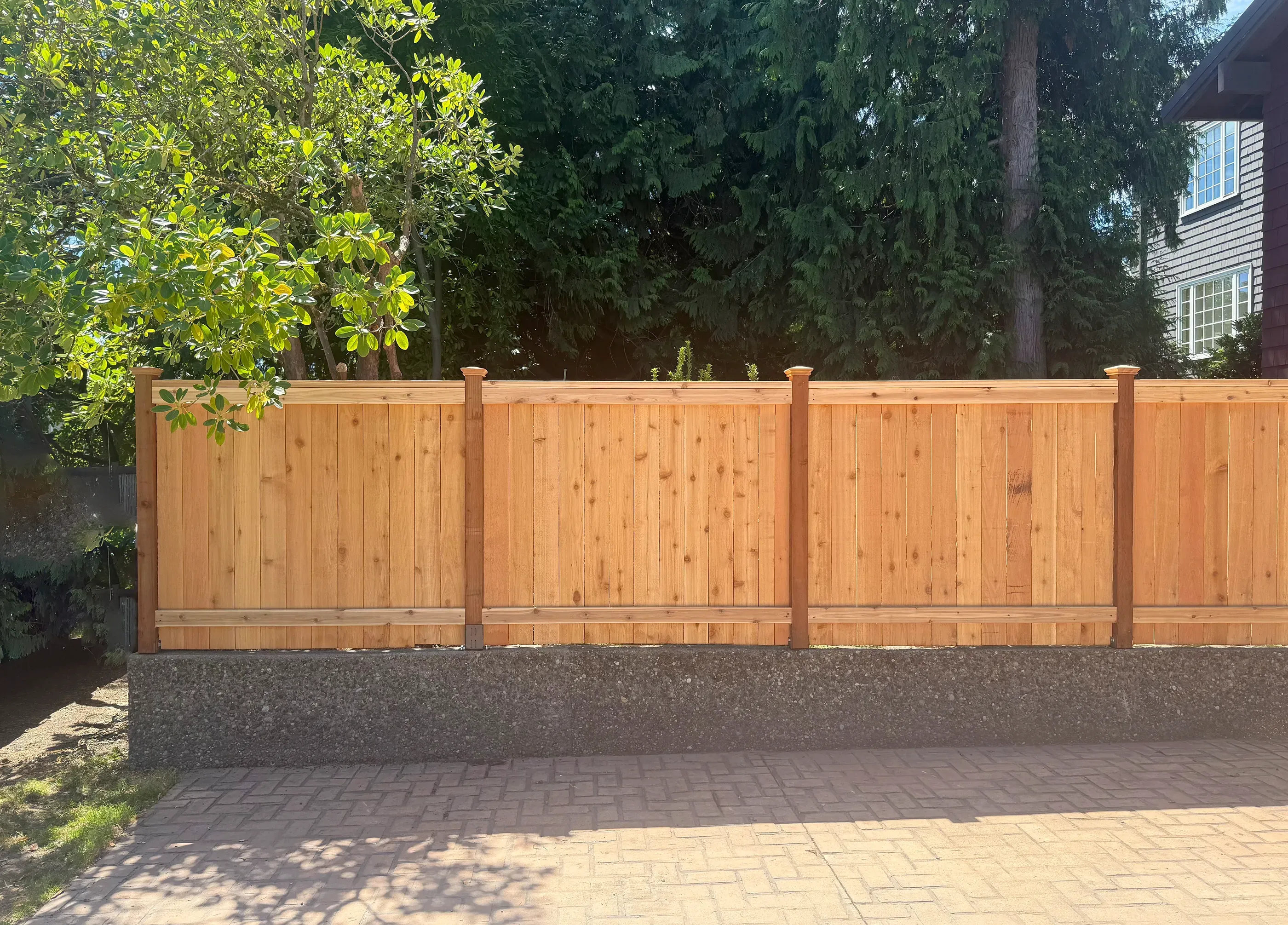 wood cap and trim fence installed by top rail fence