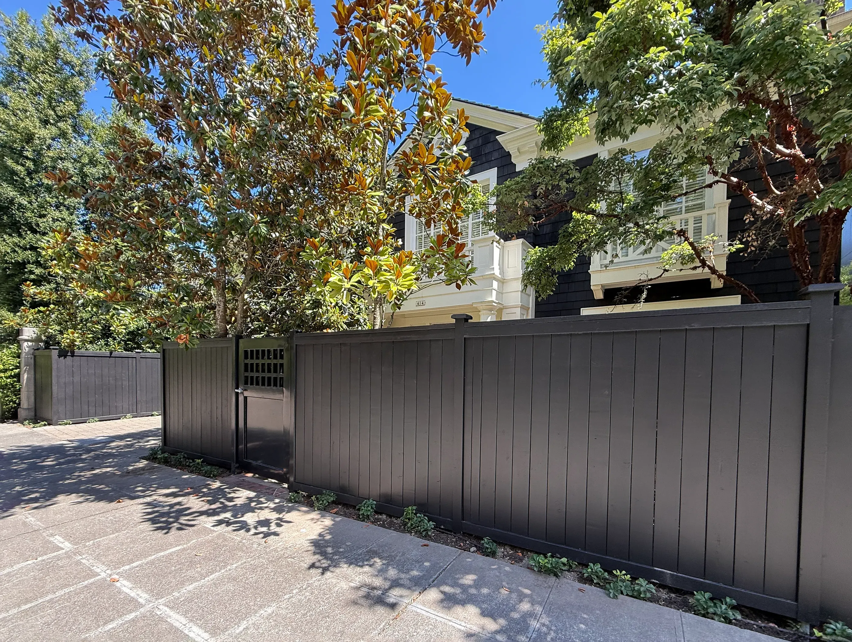 wood cap and trim fence installed by top rail fence