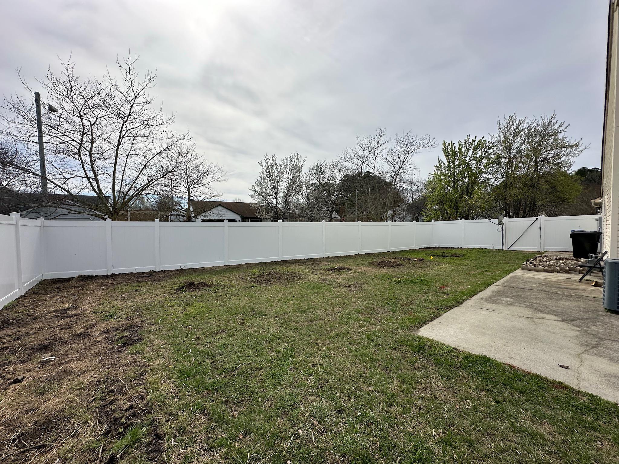 white vinyl fence installed by top rail fence