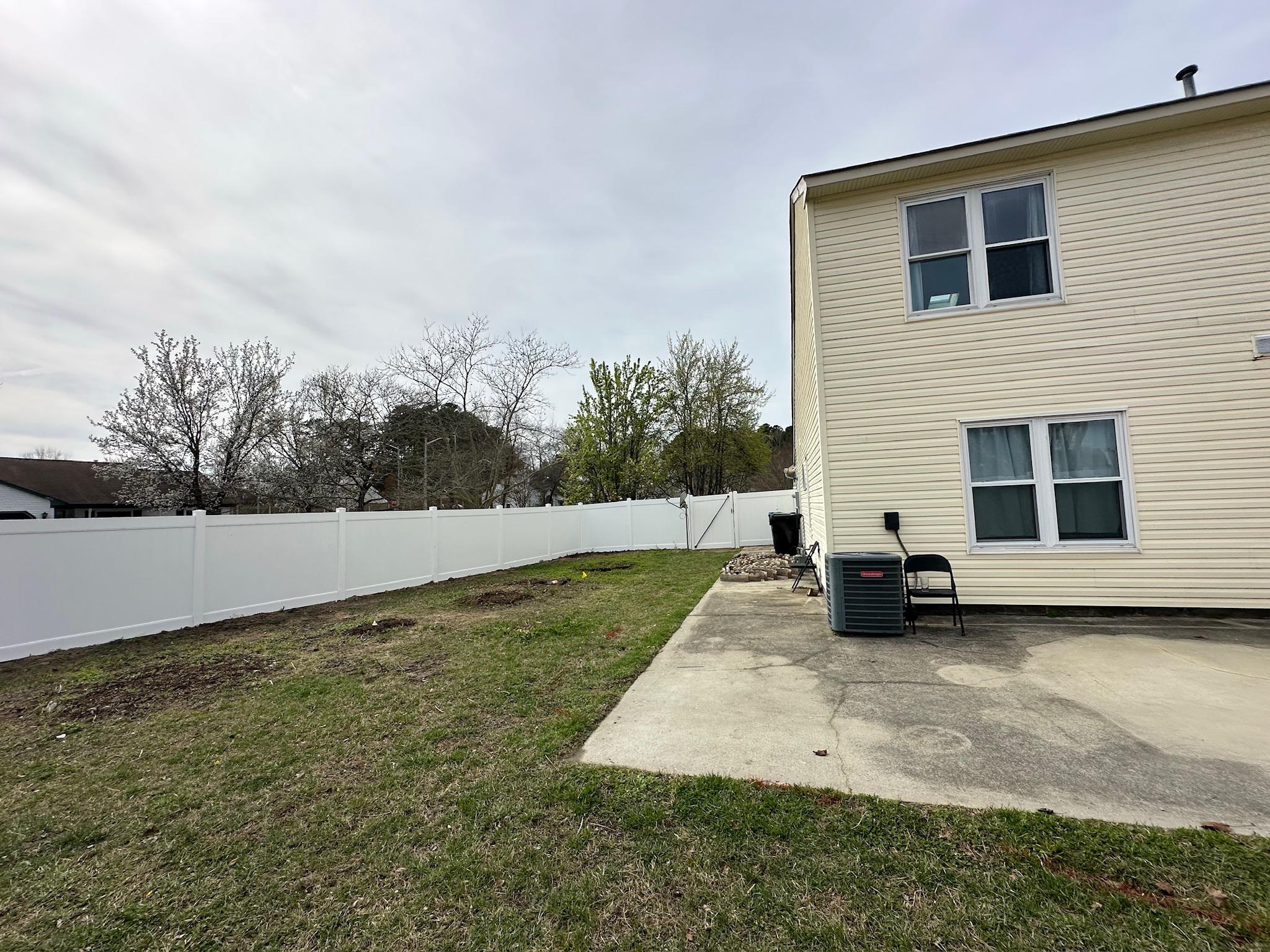 white vinyl fence installed by top rail fence