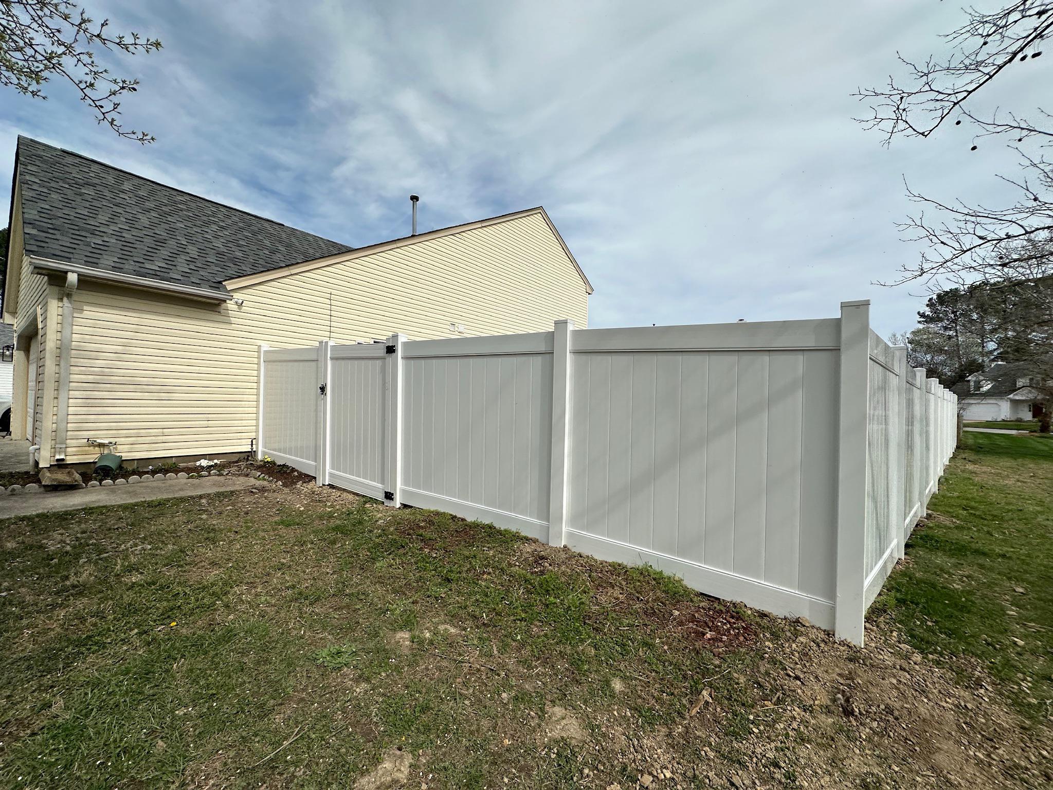 white vinyl fence installed by top rail fence