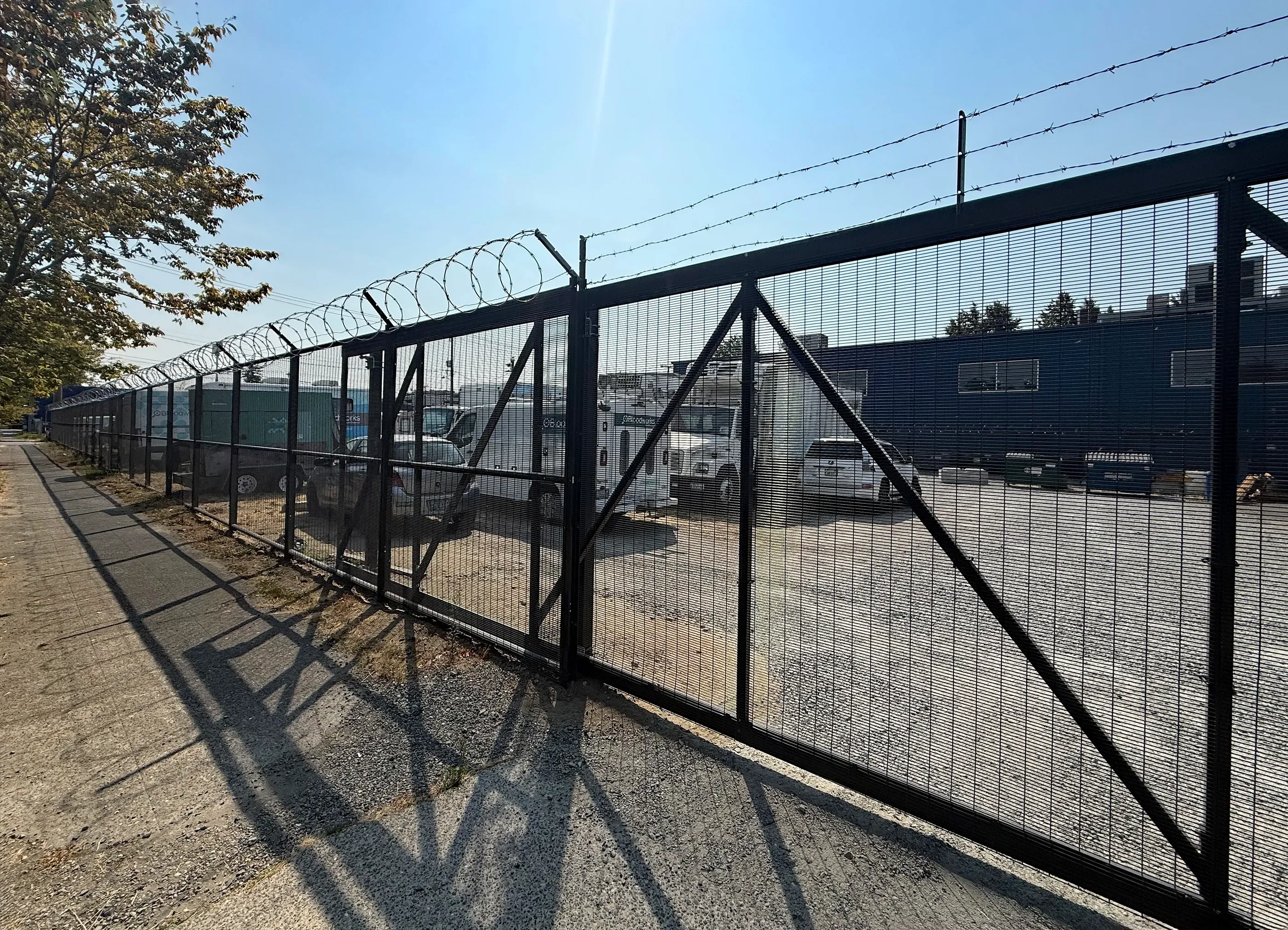 cantilever chain link gate installed by top rail fence